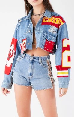 FURST OF A KIND VINTAGE NFL VINTAGE JERSEY PATCHWORK STUDDED CROPPED DENIM JACKET